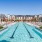 Resort-style swimming pool with lounge seating