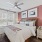 Bedroom with natural lighting and high ceilings
