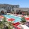 Resort-style swimming pool with lounge seating